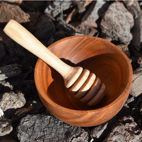 Wooden heuristic play, wooden bowl and honey dipper