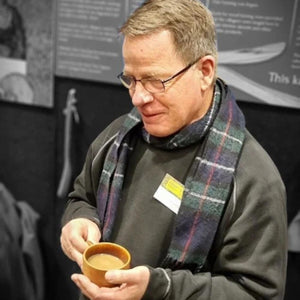 Paul_with_coffee_in_wooden_cup