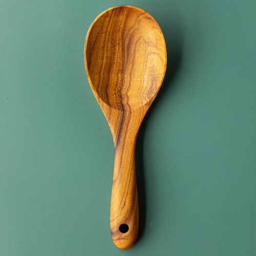 Handcrafted wooden rice serving spoon, with a gorgeous grain. The handle is handsanded, and rounded, making it easy and smooth to hold.