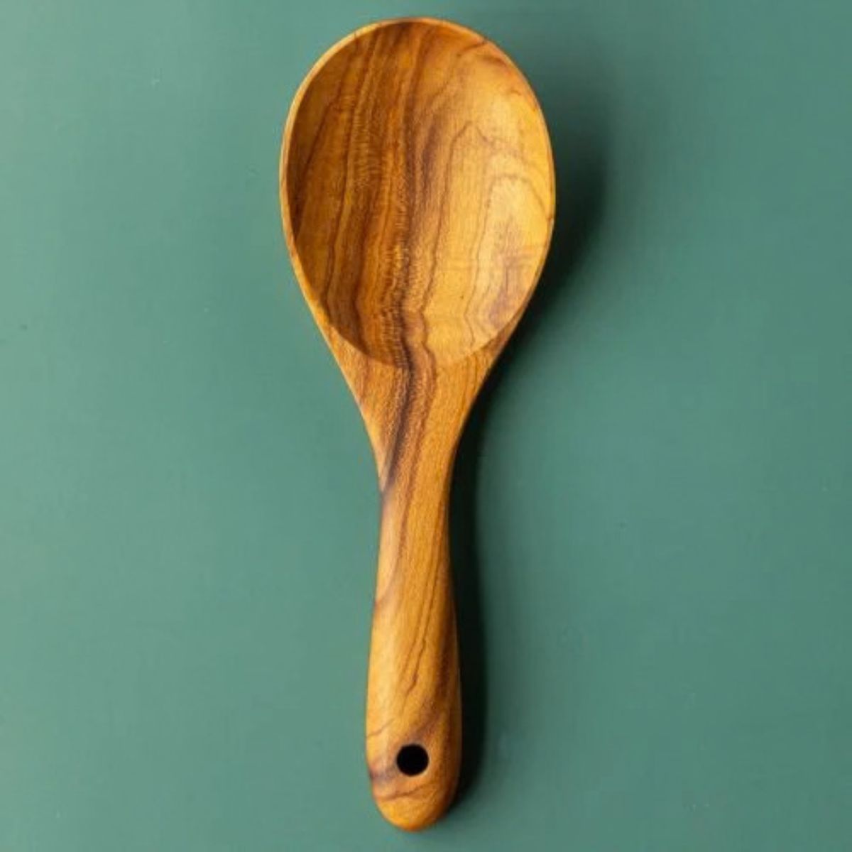 Handcrafted wooden rice serving spoon, with a gorgeous grain. The handle is handsanded, and rounded, making it easy and smooth to hold.