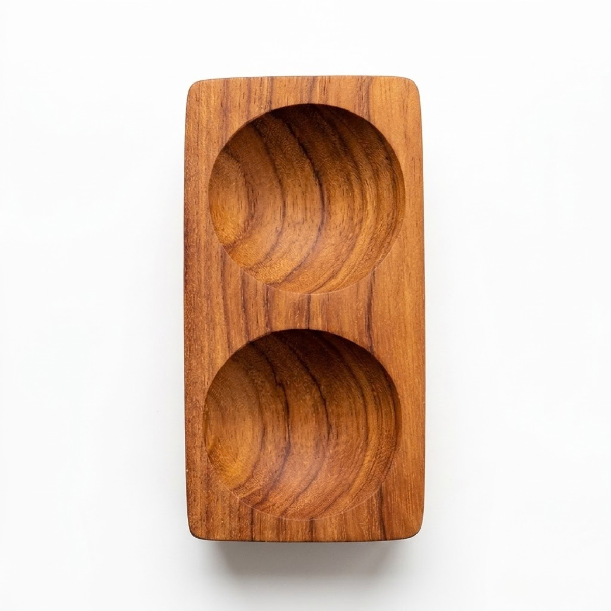 Handcrafted teak bowl, 12.5 cm's long with two indents for displaying condiments and spices on your table