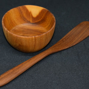 small wooden bowl and avocado knife