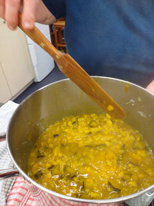 wooden spurtle being used to stir chutney