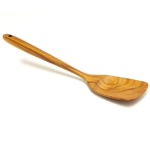 A handcrafted medium-sized teak wood spatula with a solid turner head, shown at a diagonal angle against a clean white background. The image highlights the natural, warm golden-brown wood grain and the smooth, ergonomic handle that features a functional hanging hole for easy storage. This durable, non-scratch kitchen utensil is designed for versatile everyday use, including stirring, flipping, and serving, making it a sustainable choice for high-quality cookware
