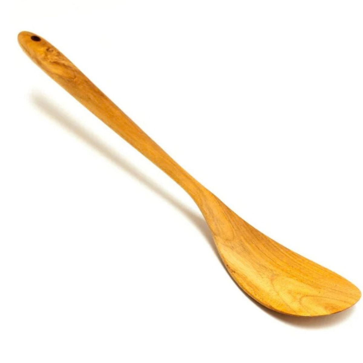A handcrafted teak wood spatula with a uniquely rounded and curved head, designed for smooth stirring and easy flipping in contoured pans or woks. Carved from a single piece of premium golden-brown teak wood, it showcases a rich natural grain and a polished, food-safe finish. The long, slender handle features a pre-drilled hanging hole for convenient storage, making it a non-toxic and durable essential for an artisanal, eco-friendly kitchen