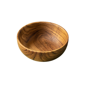 A handcrafted 11 cm teak wood bowl shown from a top-down angle against a clean white background. The bowl features deep, rounded sides and a stunning, high-contrast natural grain with swirling golden and dark brown patterns. Carved from a single piece of sustainably sourced teak, it has a smooth, food-safe finish, making it an ideal non-toxic choice for serving snacks, nuts, or side dishes in a sustainable home.
