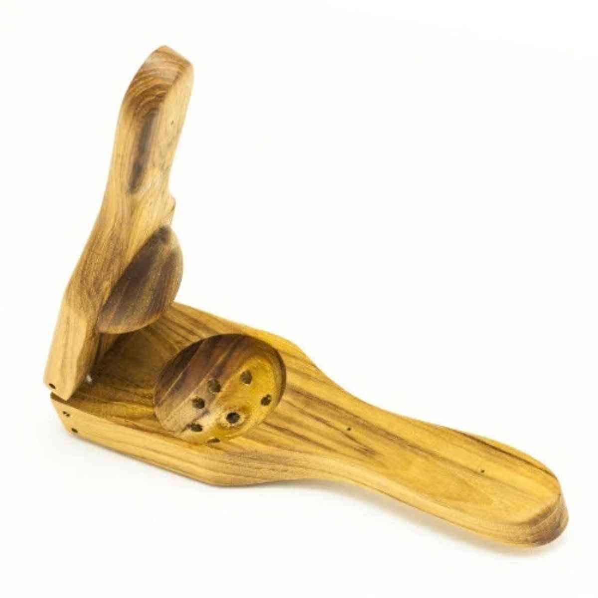 A handcrafted teak wood lemon and lime squeezer, shown open to reveal the smooth, ergonomic citrus press design. The squeezer is carved from a single piece of golden-brown teak with a rich, natural wood grain and features a functional drainage hole pattern for effortless juicing. This eco-friendly, non-toxic kitchen tool is designed for durability and a comfortable grip, perfect for a sustainable and artisanal kitchen collection.