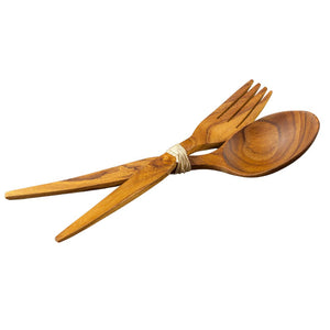 Handcrafted teak wood salad server set featuring a serving fork and spoon tied together with natural twine, isolated on a white background.