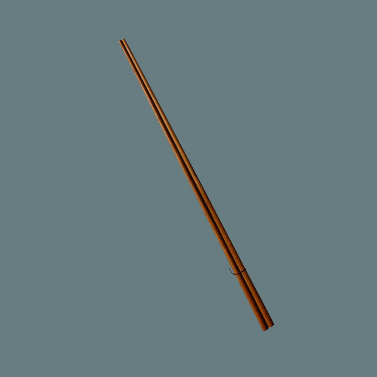 A pair of long, slender brown wooden chopsticks with a glossy finish, arranged diagonally on a solid slate gray background.