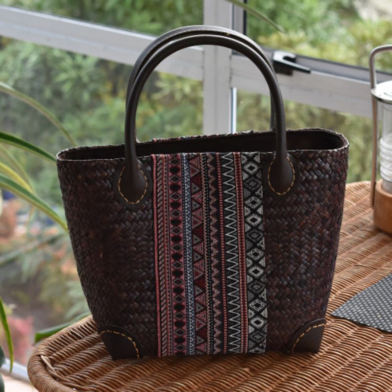 handwoven bag with leather handles and fabric design