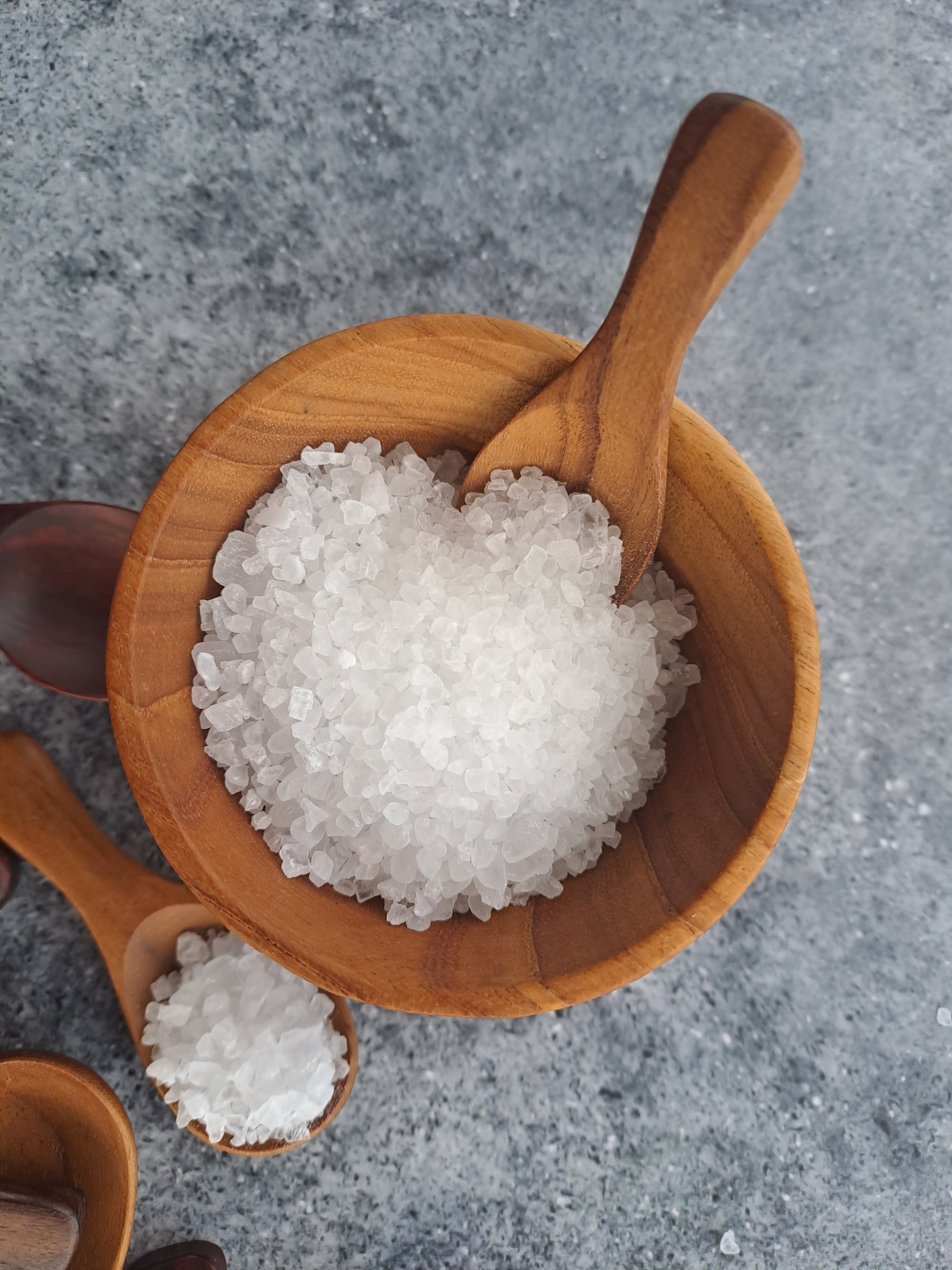 small wooden bowl and salt spoons