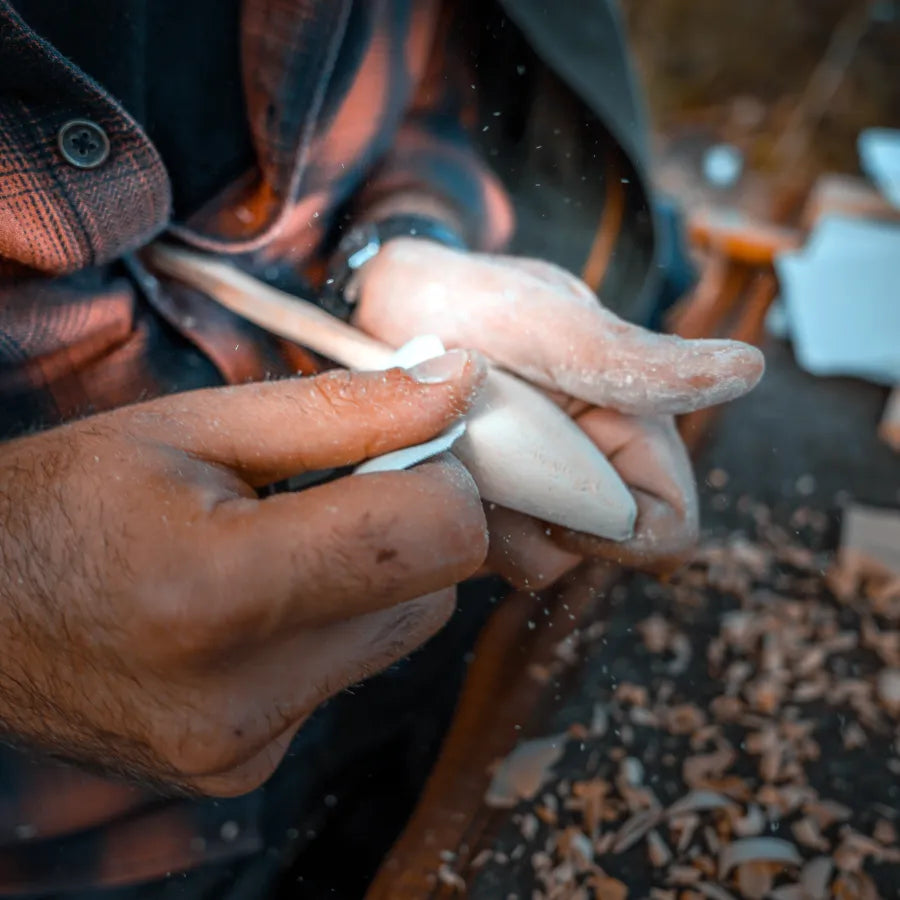 hand crafting spoons with wood