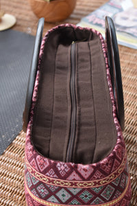 handwoven bag with wooden handles
