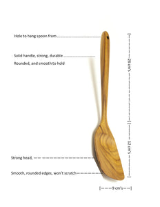 A technical product diagram of a handcrafted wooden spatula against a white background, displaying precise measurements and key features. The image indicates a total handle length of 26 cm and a head length of 12 cm with a 9 cm width. Annotated features include a hanging hole for storage, a solid durable handle with a rounded smooth grip, and a strong head with smooth rounded edges designed to be non-scratch for cookware