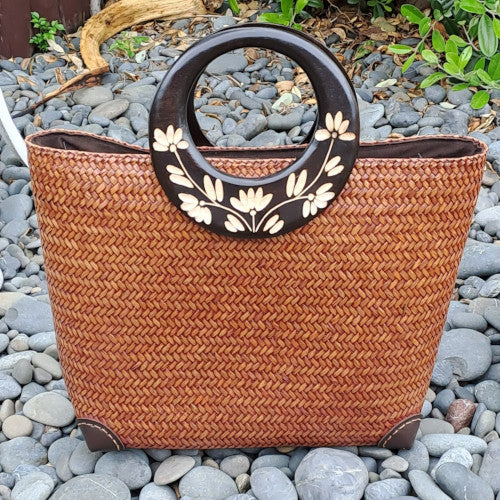 Striking hand woven bag with wooden handles