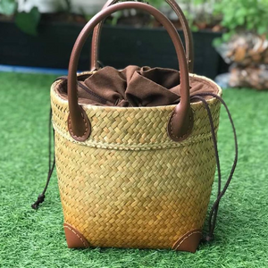 Handwoven bag with leather handles