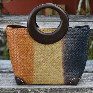 handwoven bag with wooden handles