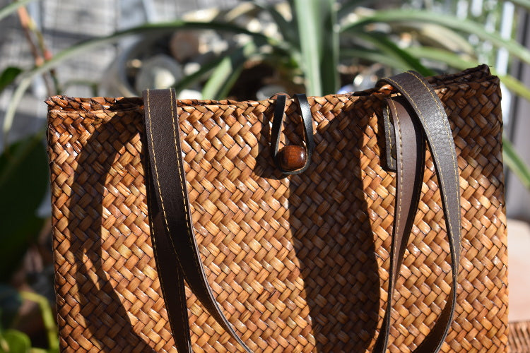 light brown shoulder bag with leather handles