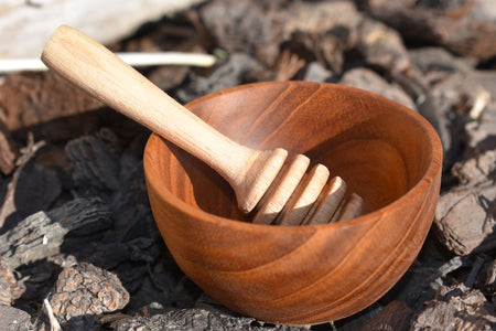 handcrafted teak bowl and small honey dipper