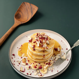 wooden spatula beside pancake stack
