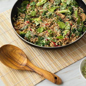 wooden serving spoon beside cooked dish